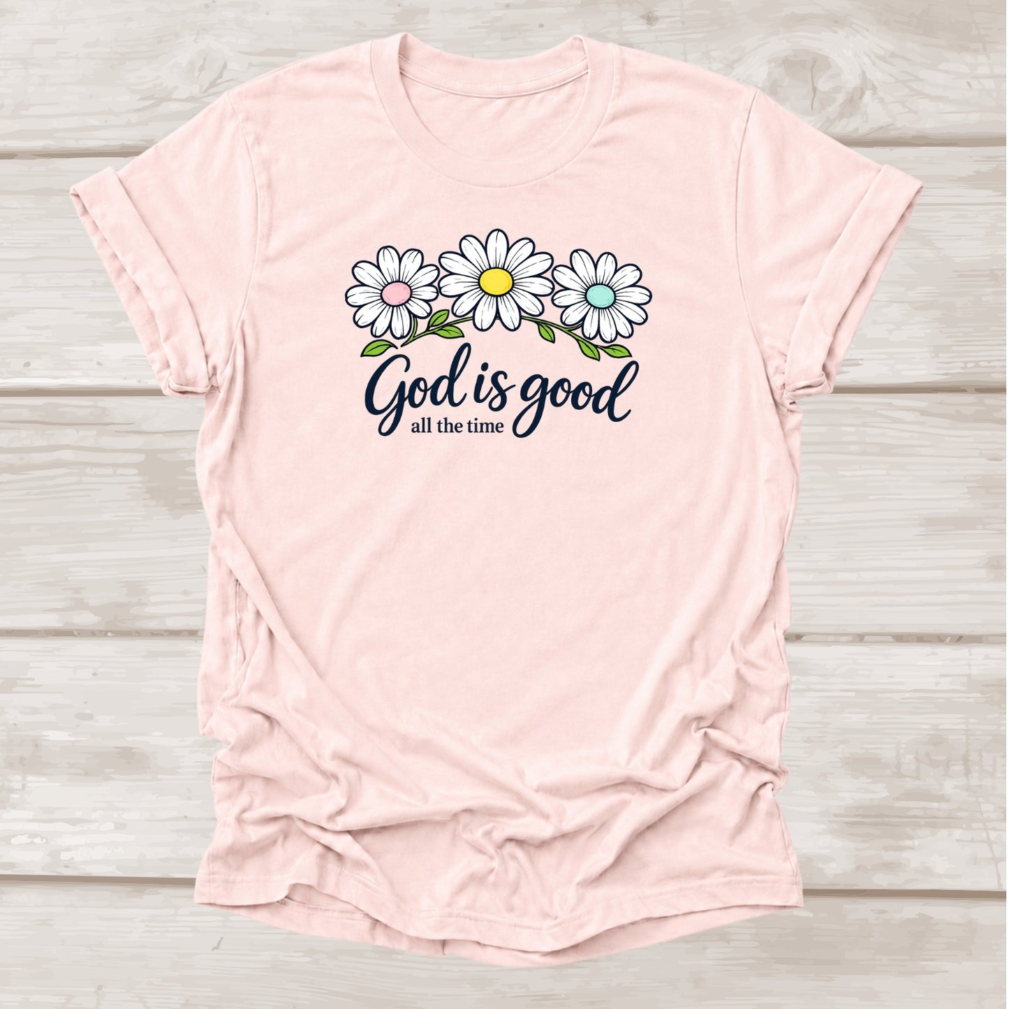God is Good All the Time Christian t-shirt with daisy floral graphic in soft pink β BEE Grace-full